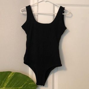 Low back, black body suit